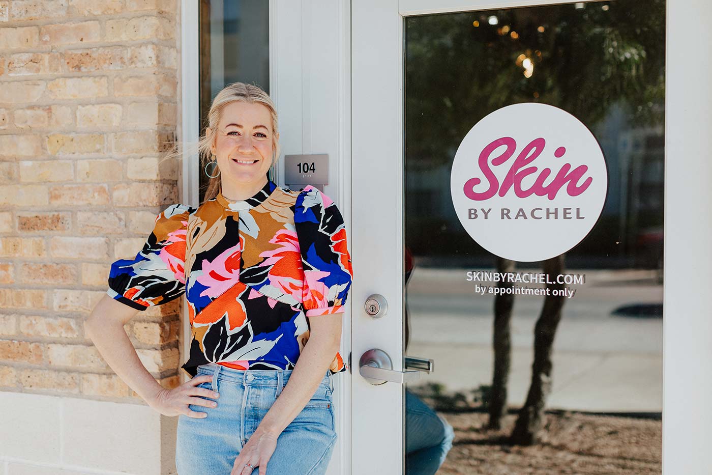 Rachel Spillman owner of Skin by Rachel standing outside her store entrance